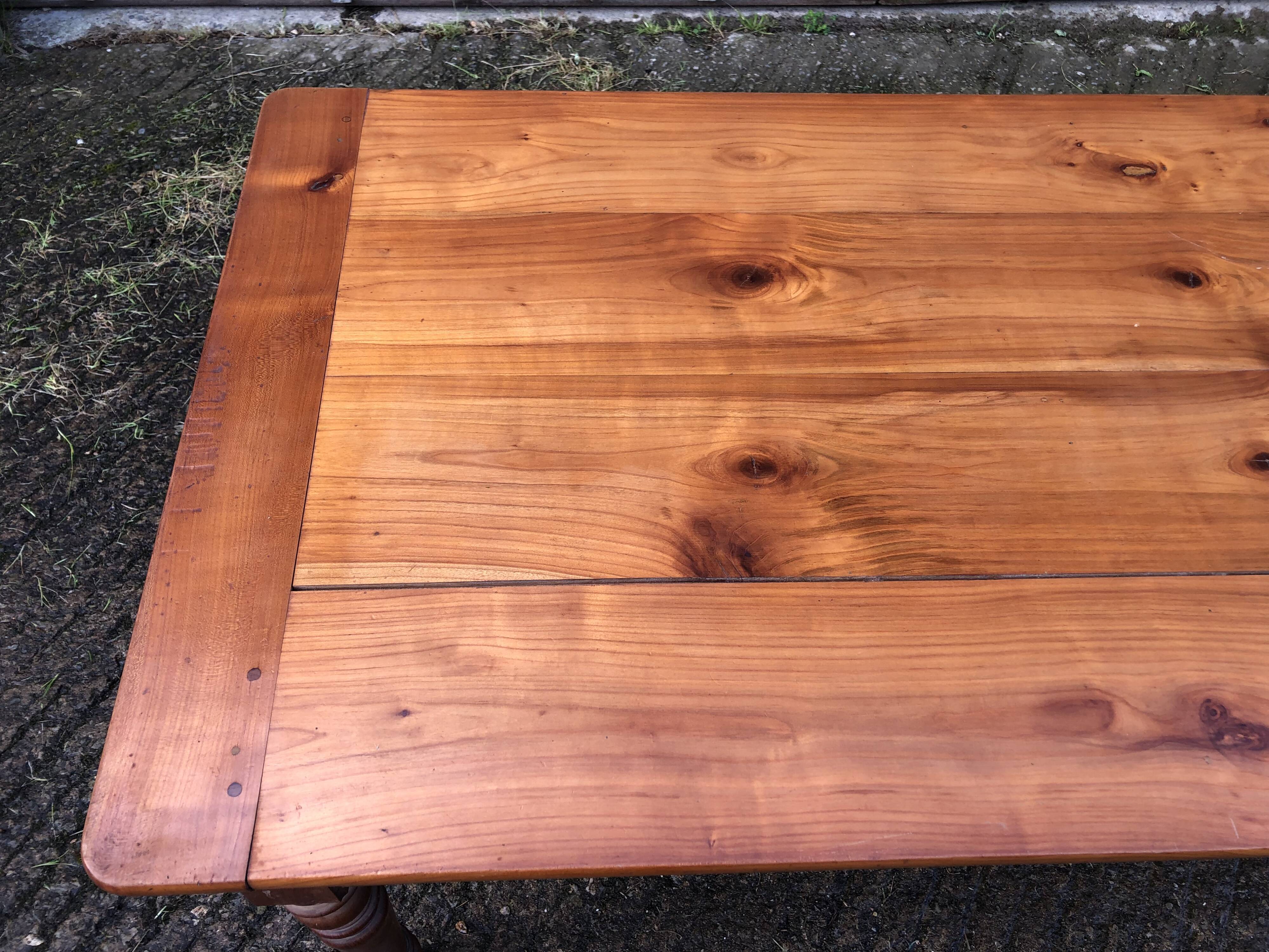 Antique farmhouse table in solid cherry wood in Louis Philippe style.