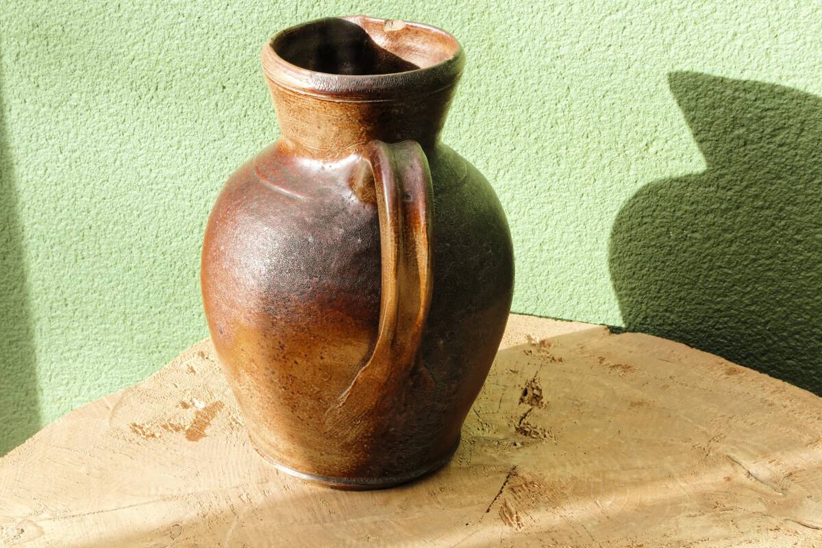 Large stoneware jug with a family name pattern, 1912