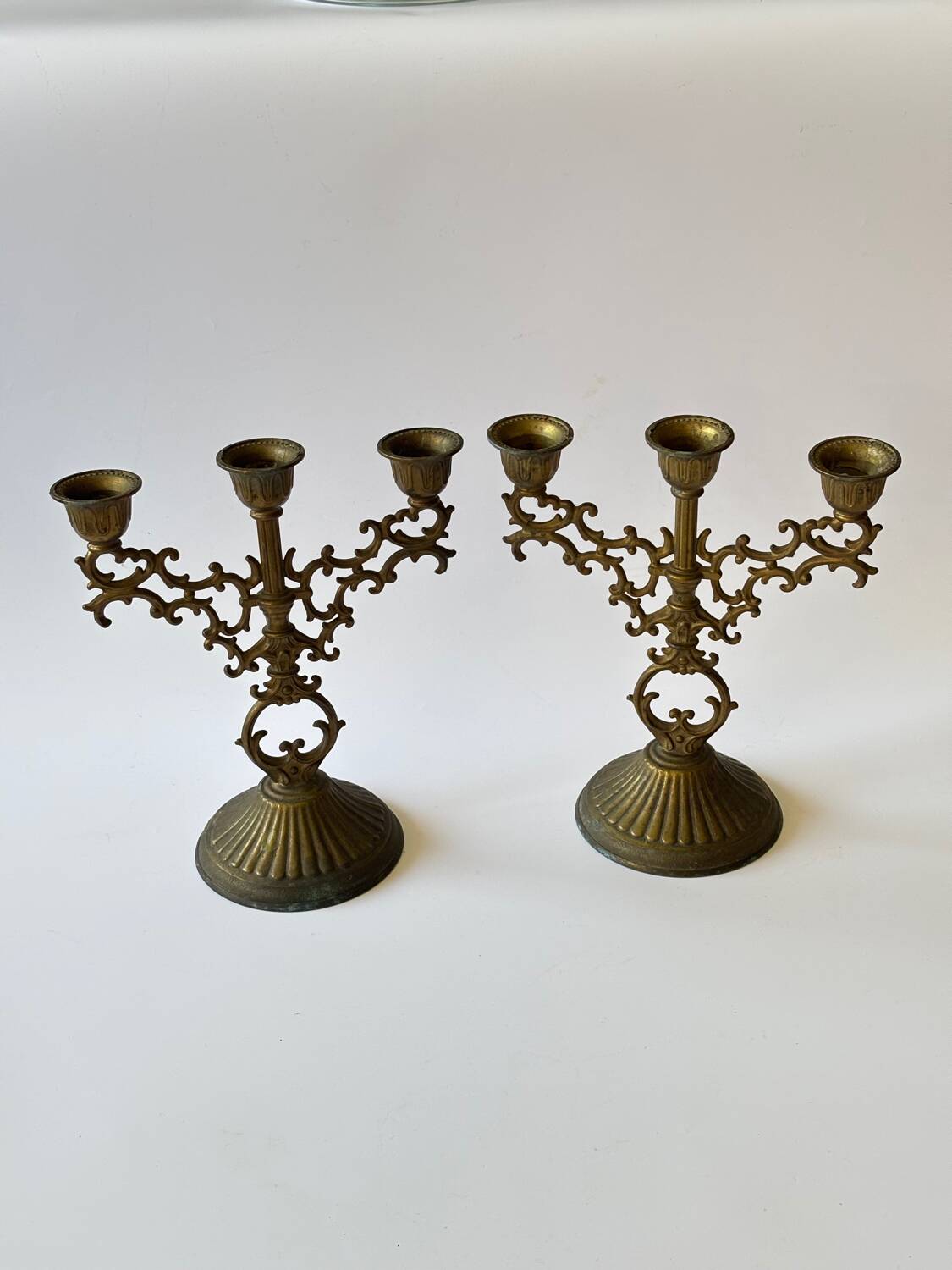 Pair of baroque style brass candlesticks