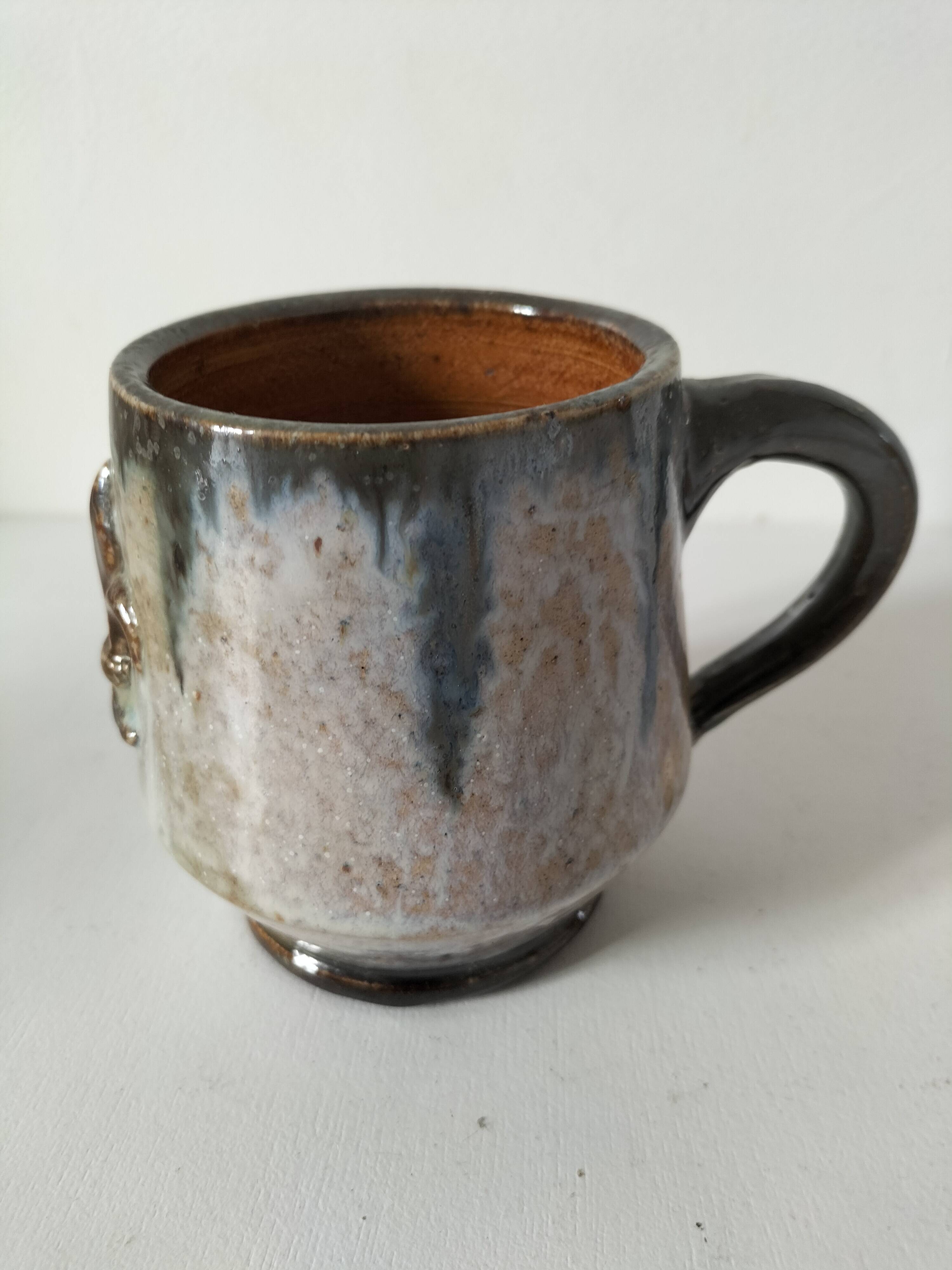 Fleur-de-lis glazed earthenware mug