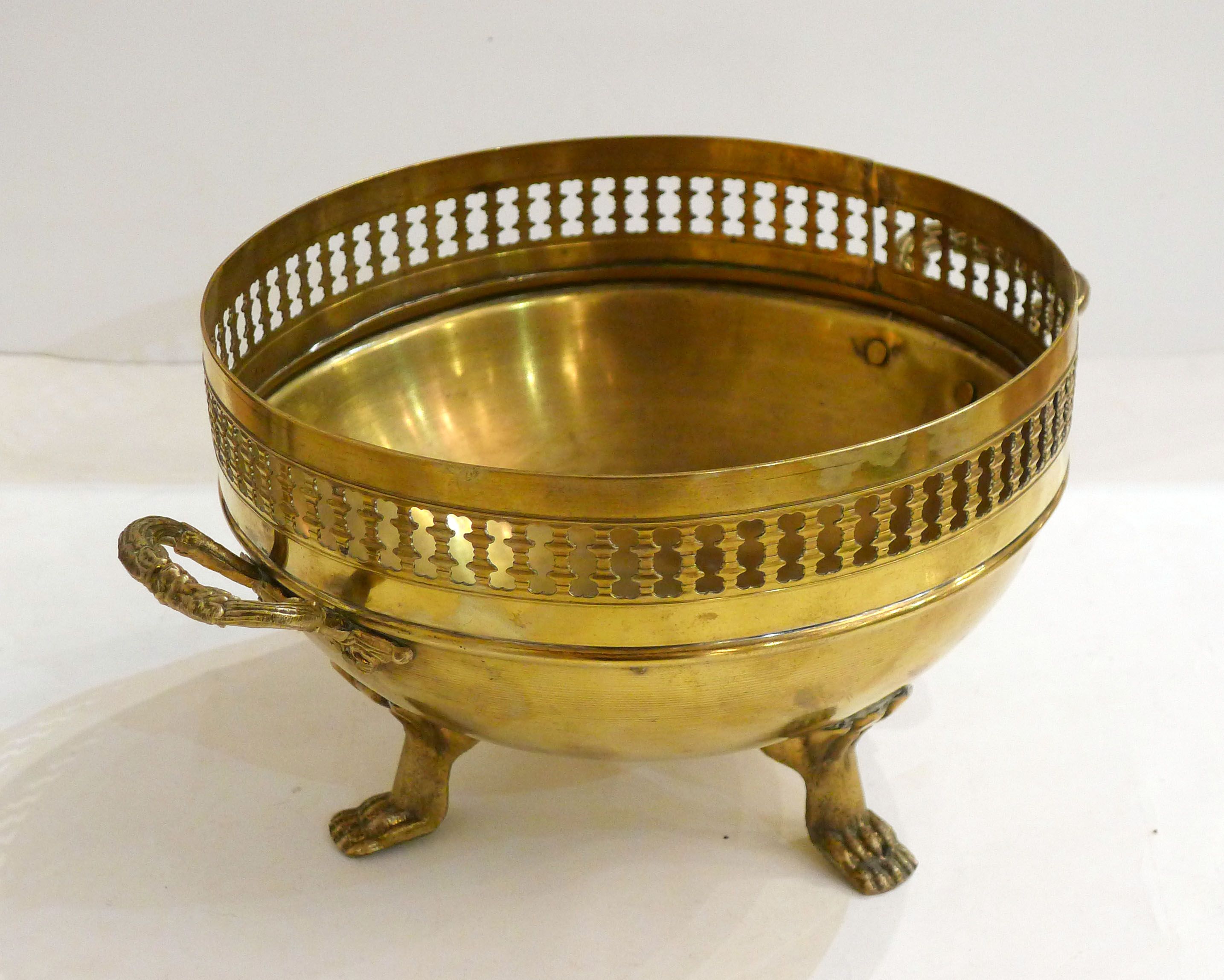 Planter on lion legs, made of golden metal