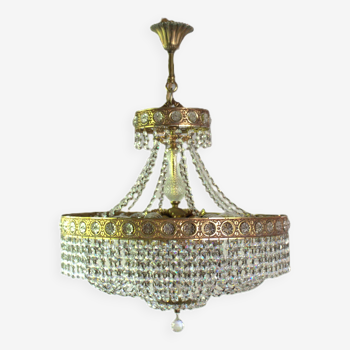 Antique castle style chandelier with tassels and floral details