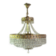 Antique castle style chandelier with tassels and floral details
