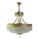 Antique castle style chandelier with tassels and floral details