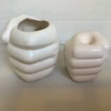 Duo of candle holder and empty pocket in the shape of a hand