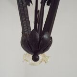 French Art Nouveau leaf detail iron three-light chandelier with amber glass shades.