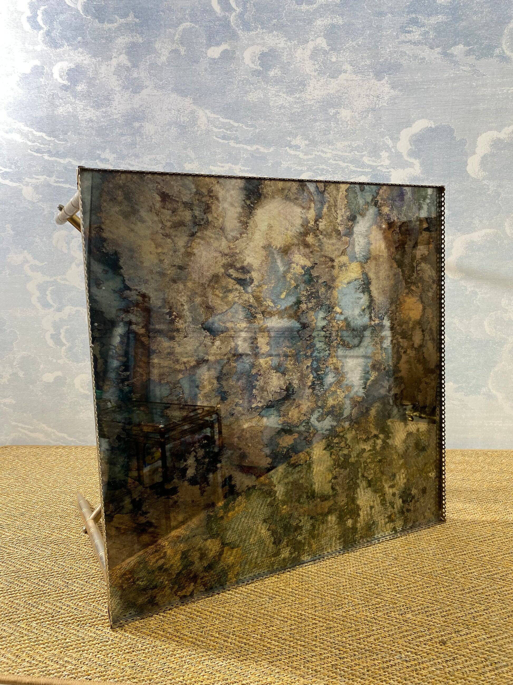 Side table with oxidised metal mirror top on a brass frame, France, 1960s.