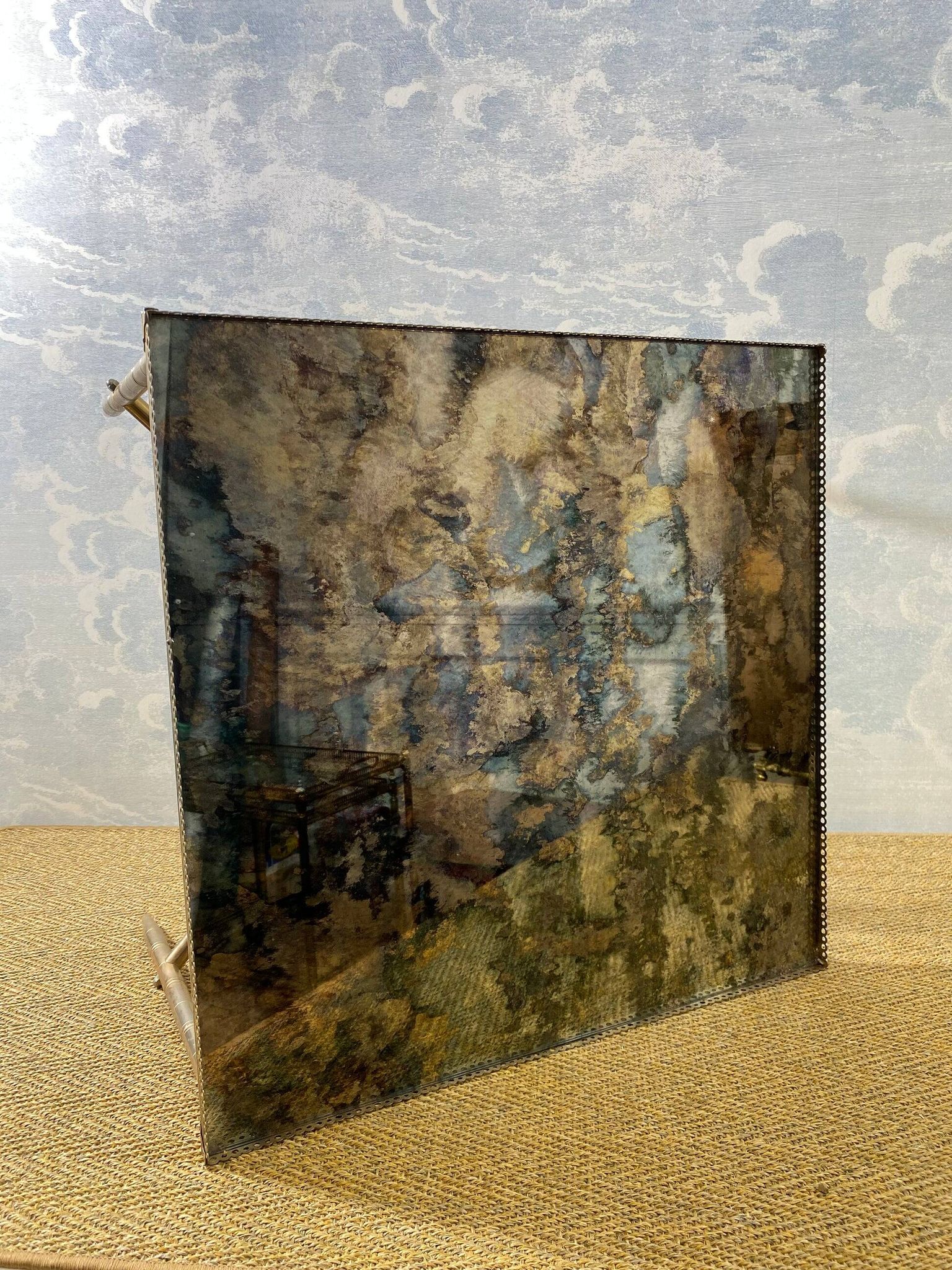 Side table with oxidised metal mirror top on a brass frame, France, 1960s.