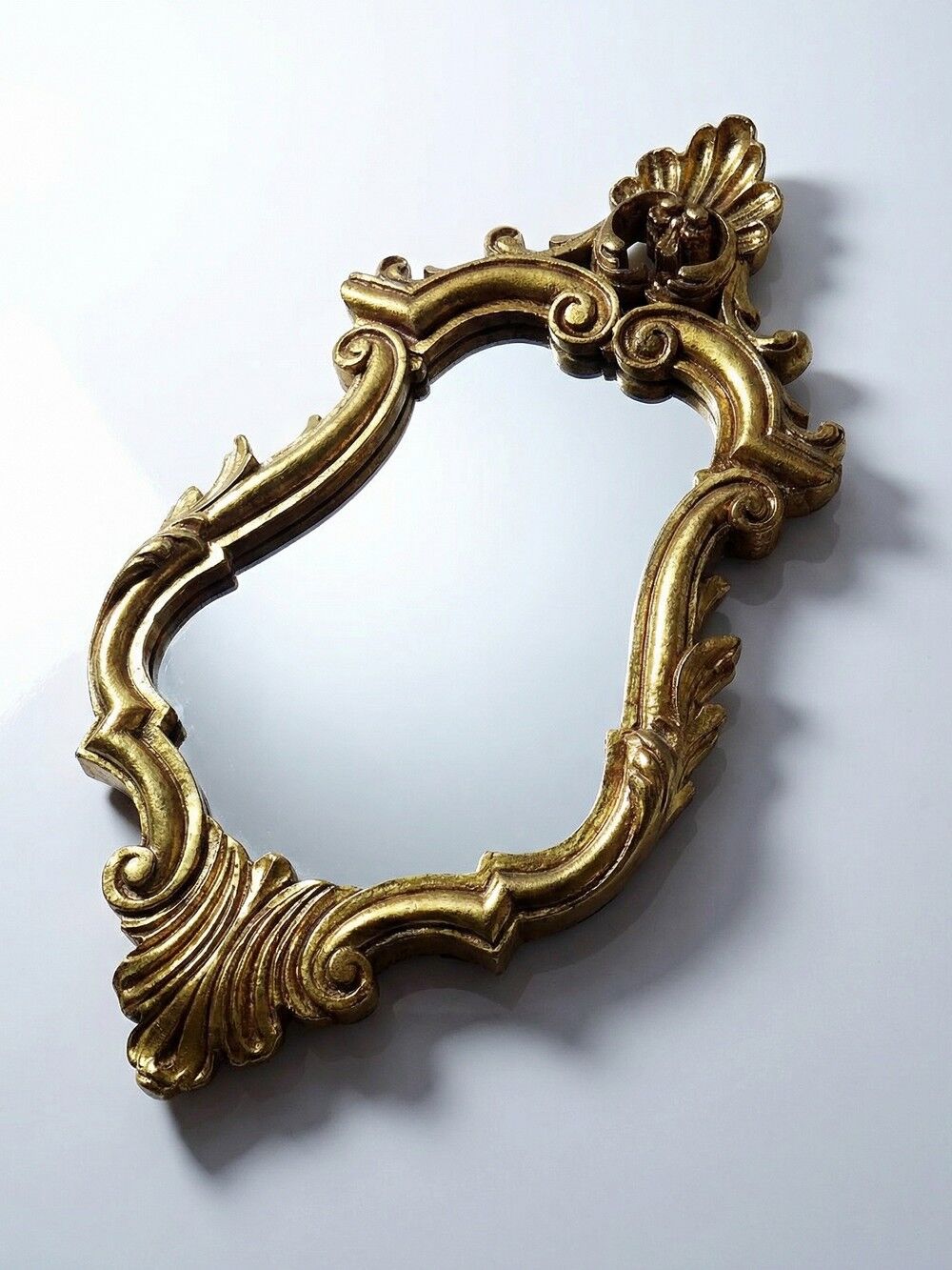 Vintage Rococo wall mirror, gold, Italy, circa 1950-1970, wood and gilded stucco.