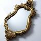 Vintage Rococo wall mirror, gold, Italy, circa 1950-1970, wood and gilded stucco.