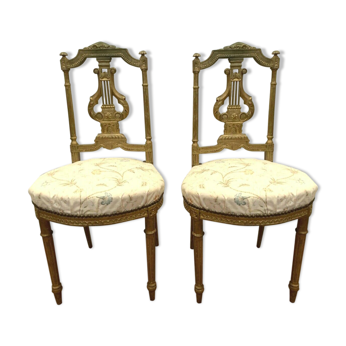 Pair of Louis XVI style chairs in 20th century gilded wood