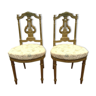 Pair of Louis XVI style chairs in 20th century gilded wood