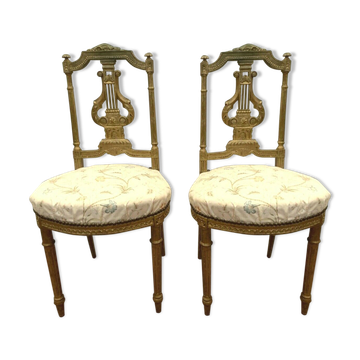 Paire de chaises de style Louis XVI en bois doré XX siècle