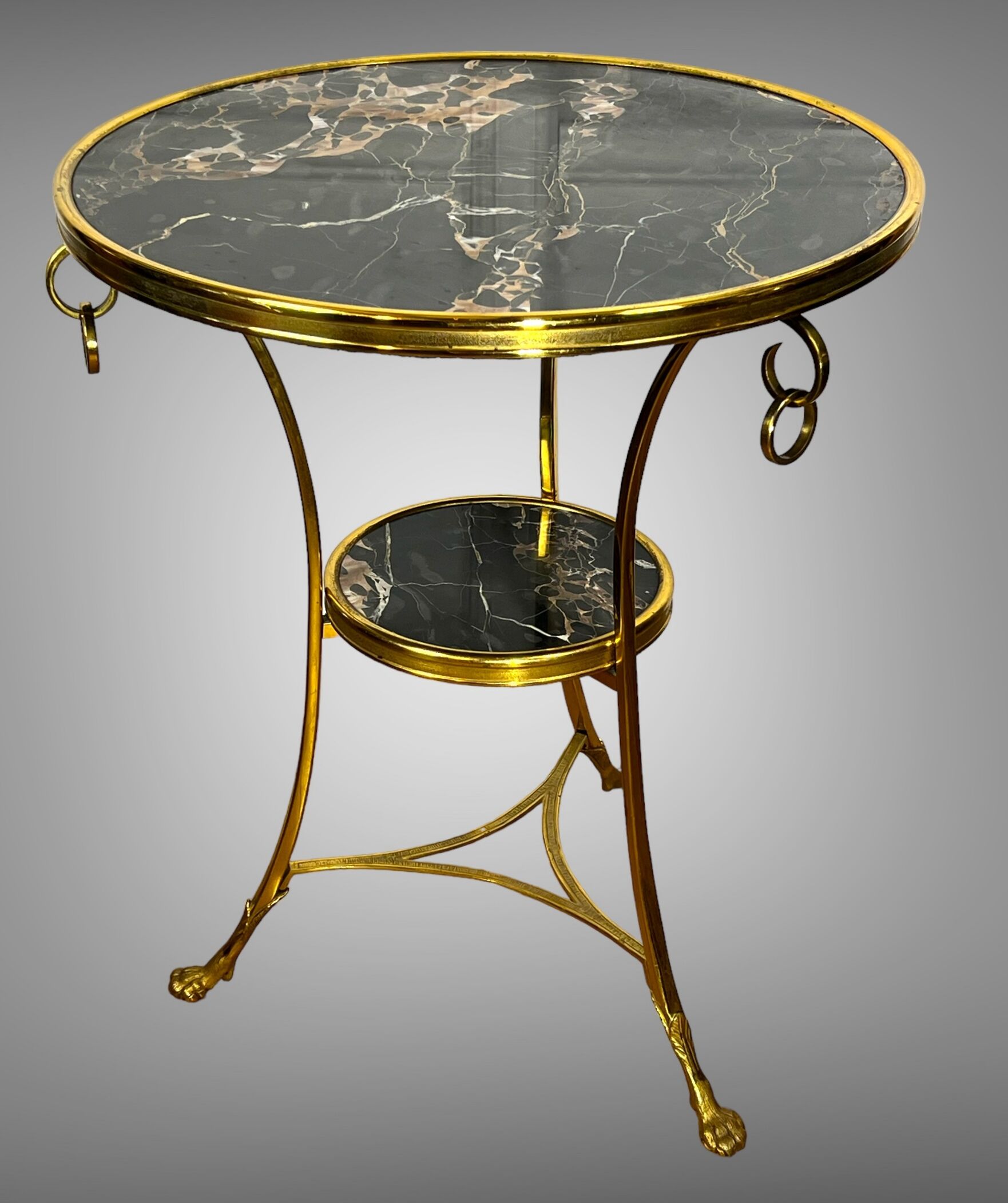 Gueridon tripod with gilded bronze frame covered with portor marble