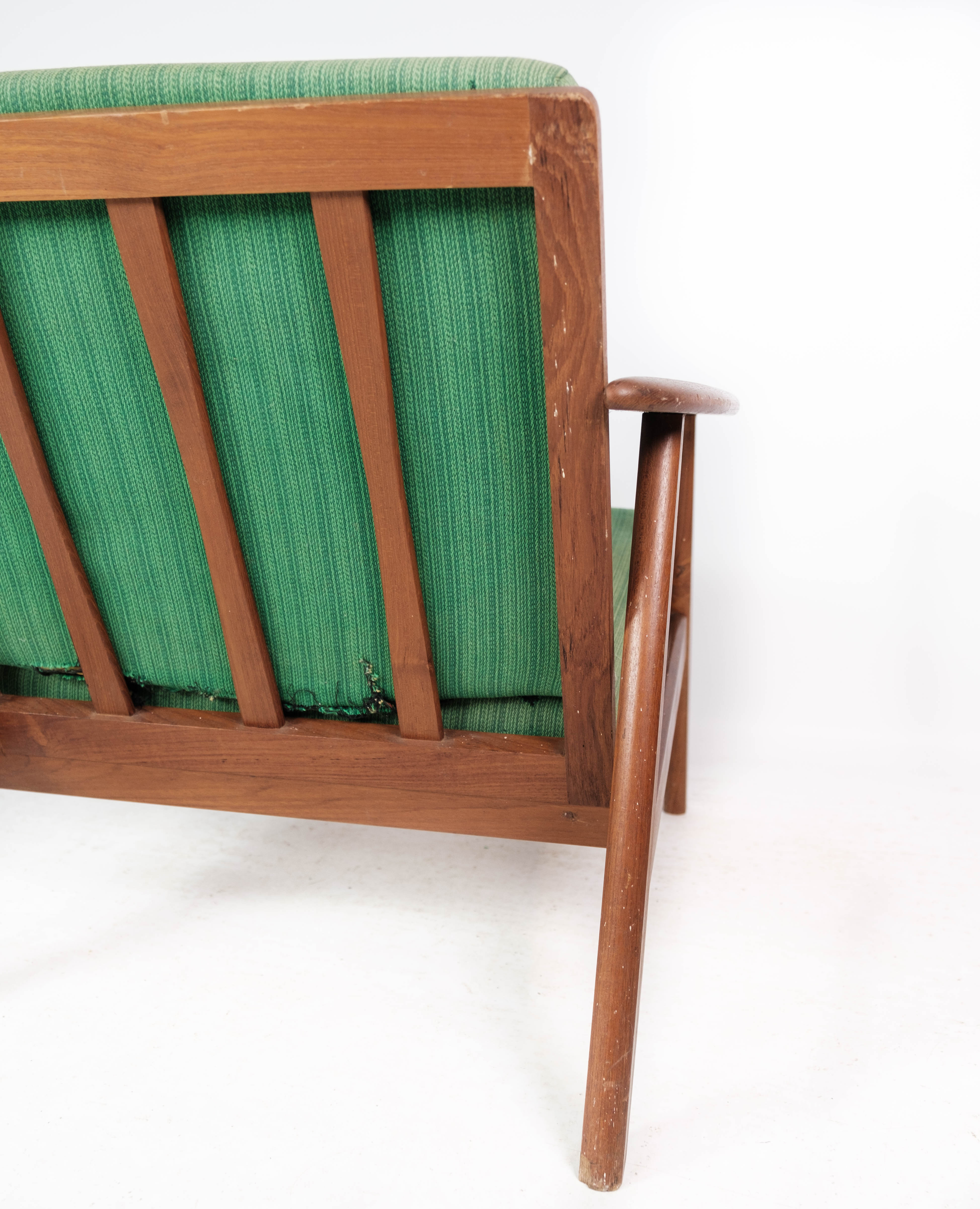 Easy chair in teak and with green upholstery of Danish design, 1960s