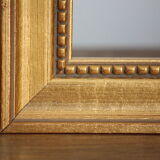 Carved and moulded gilded wood frame