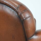 Sheepskin art deco design armchair with timeless and warm colours