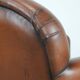 Sheepskin art deco design armchair with timeless and warm colours