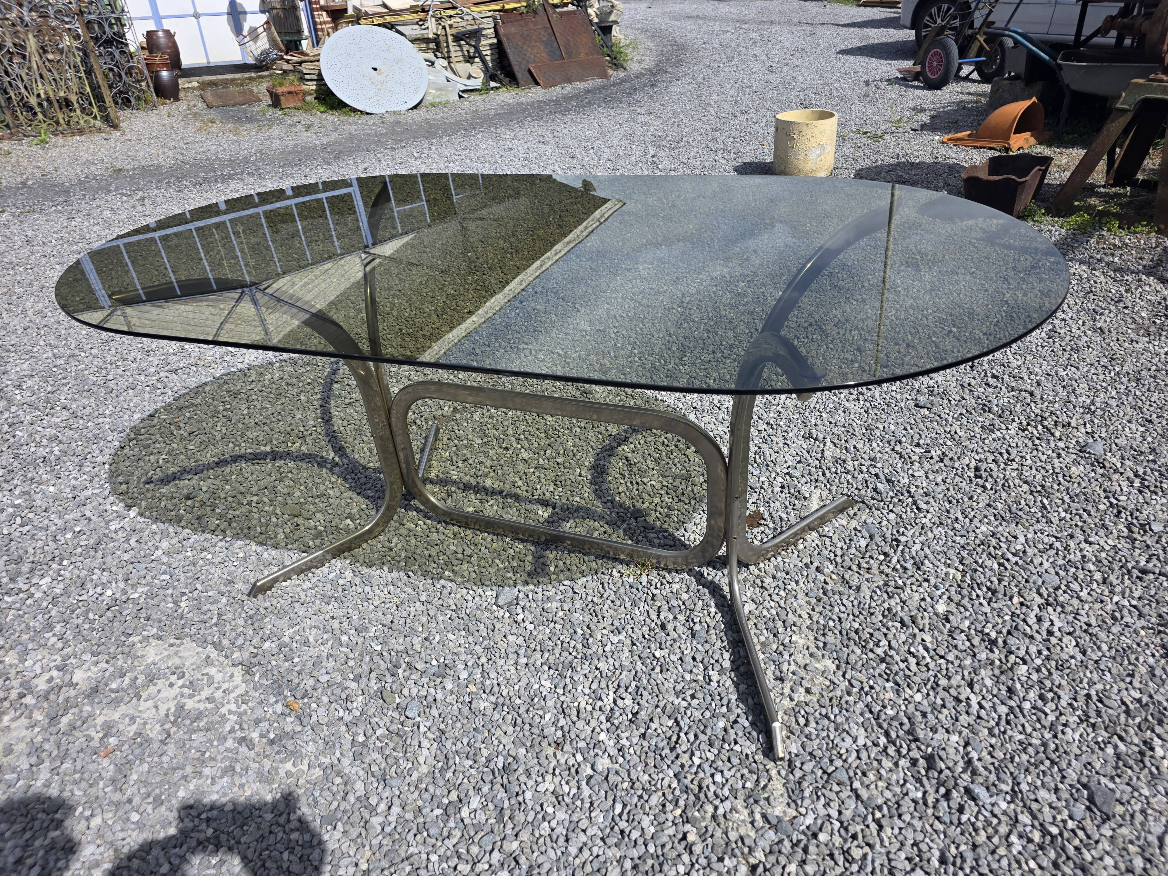 Silver metal table with smoked glass top from the 1970s.