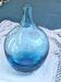 Vintage handmade aqua blue glass bud vase from the 1990s