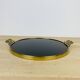 Black plateau and gilded brass from the 1950s.