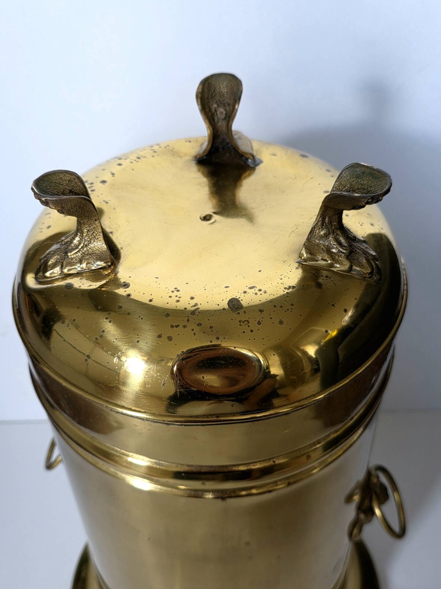 Hollywood Regency style umbrella stand, brass finish and lio pattern.