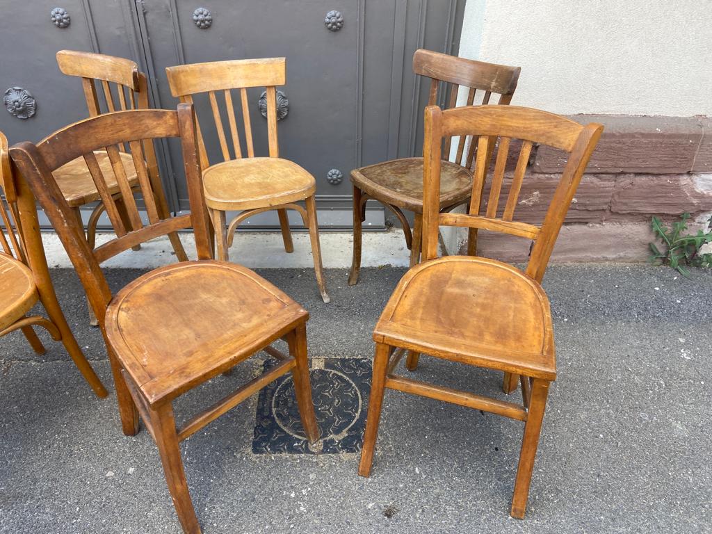 Set of 10 mismatched curved wood bistro chairs from the 1950s-60s