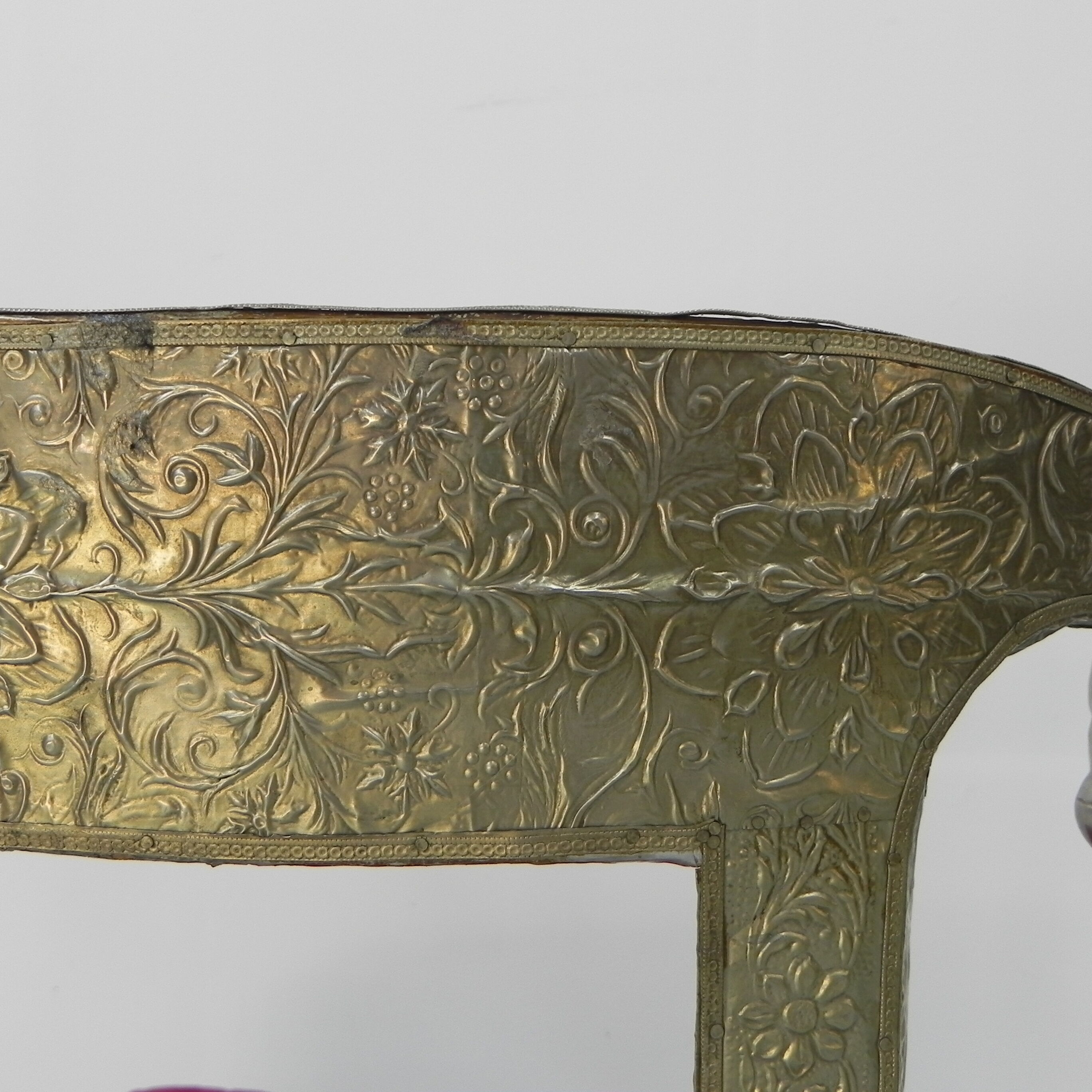 Dining chair upholstered with stamped tin