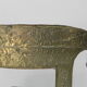 Dining chair upholstered with stamped tin
