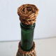 Glass and wicker bottle