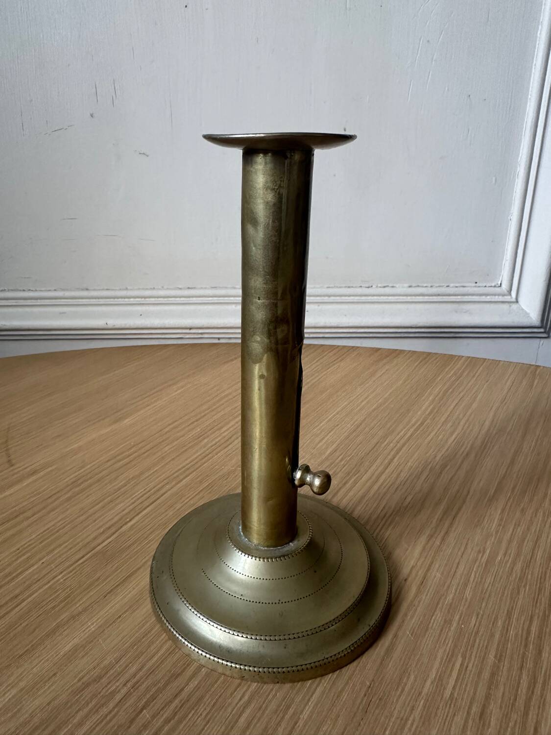 Old brass pull candle holder