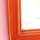 Beveled glass wall mirror in solid wood frame