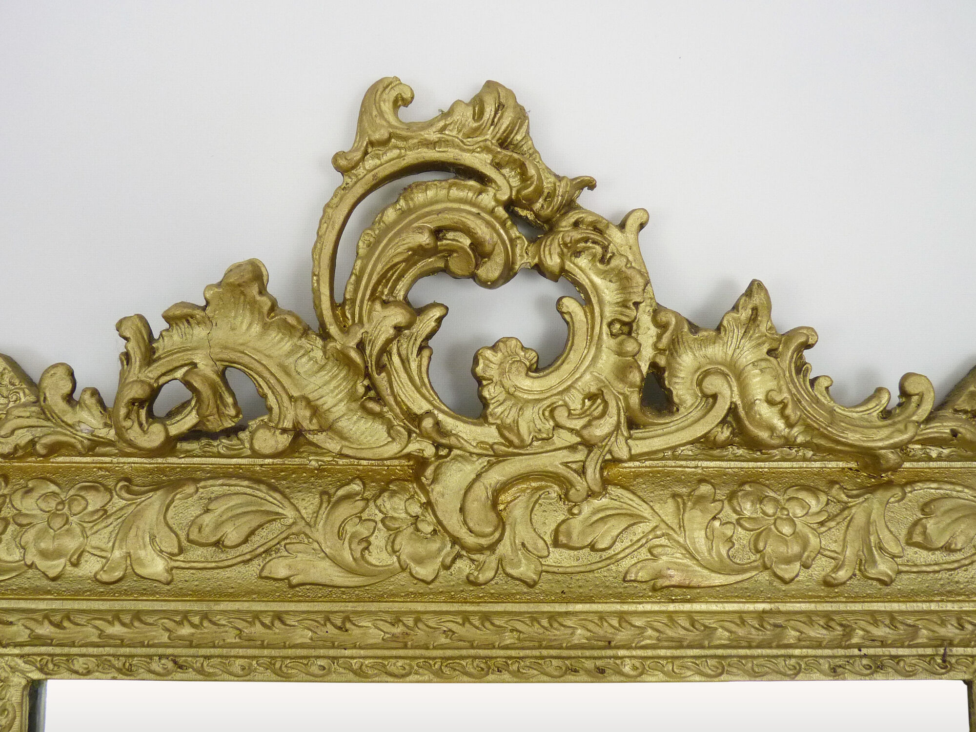 Old wall mirror in wood and gilded stucco, Louis XVI style. XIXth