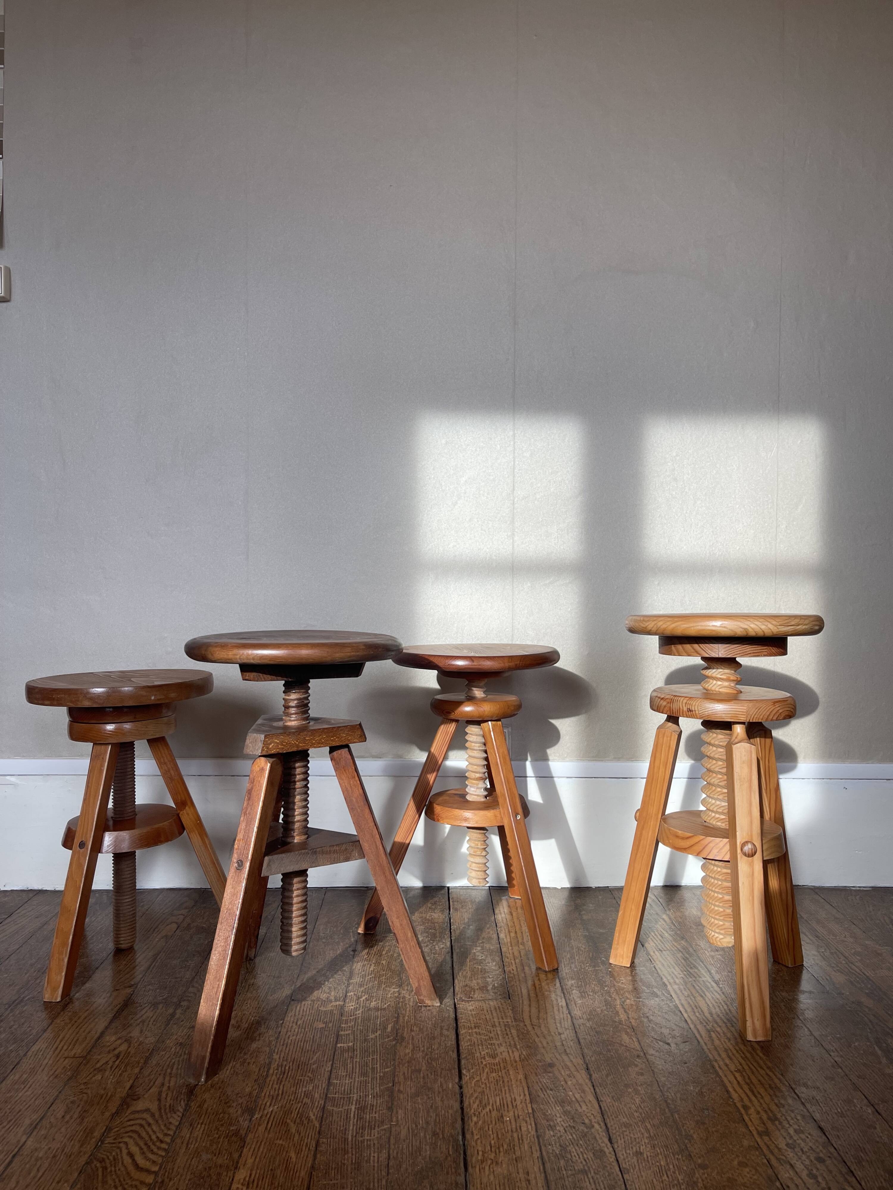 Set of 4 wooden screw stools.