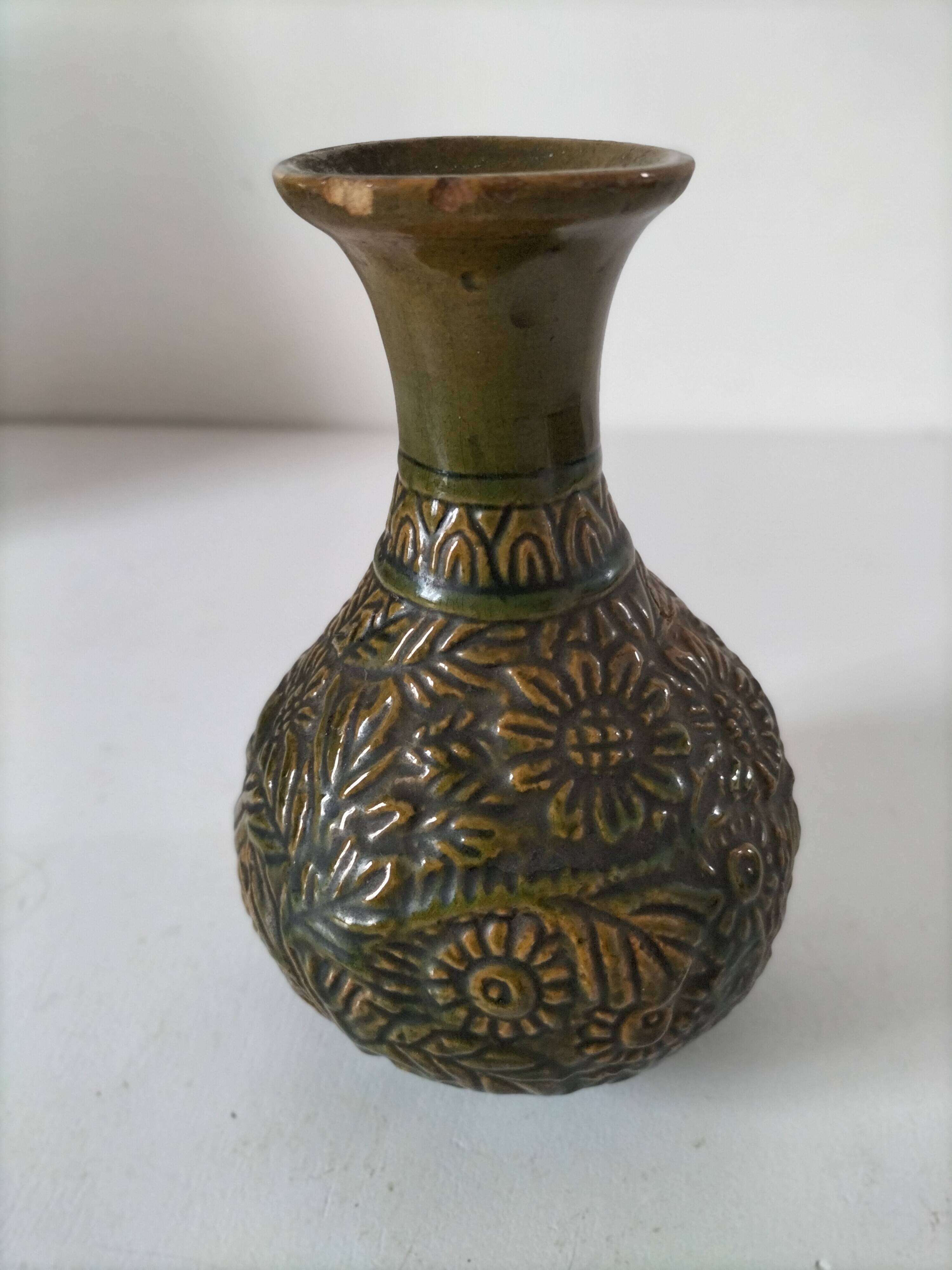 Small glazed vase with raised floral decoration