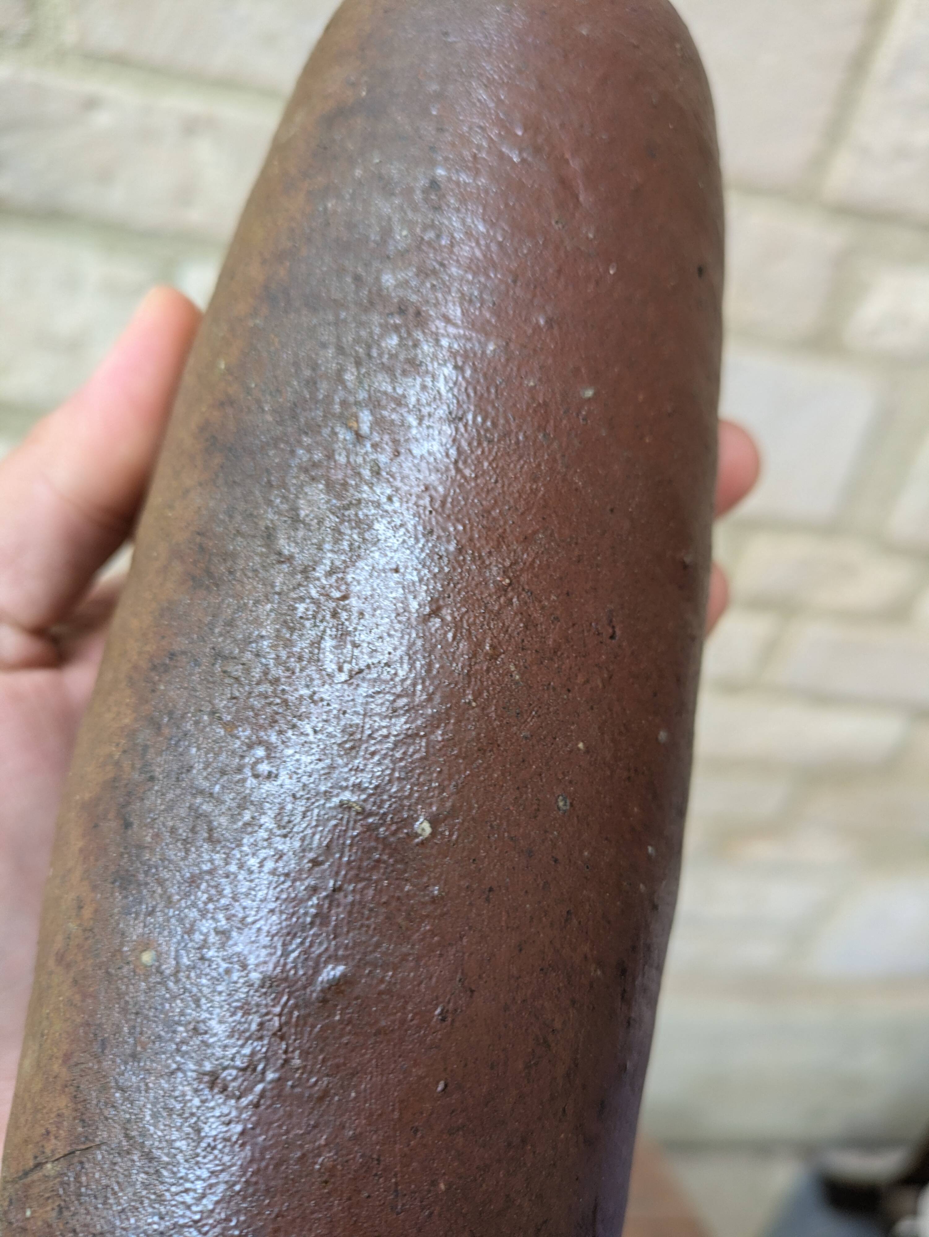Old handmade terracotta bottle