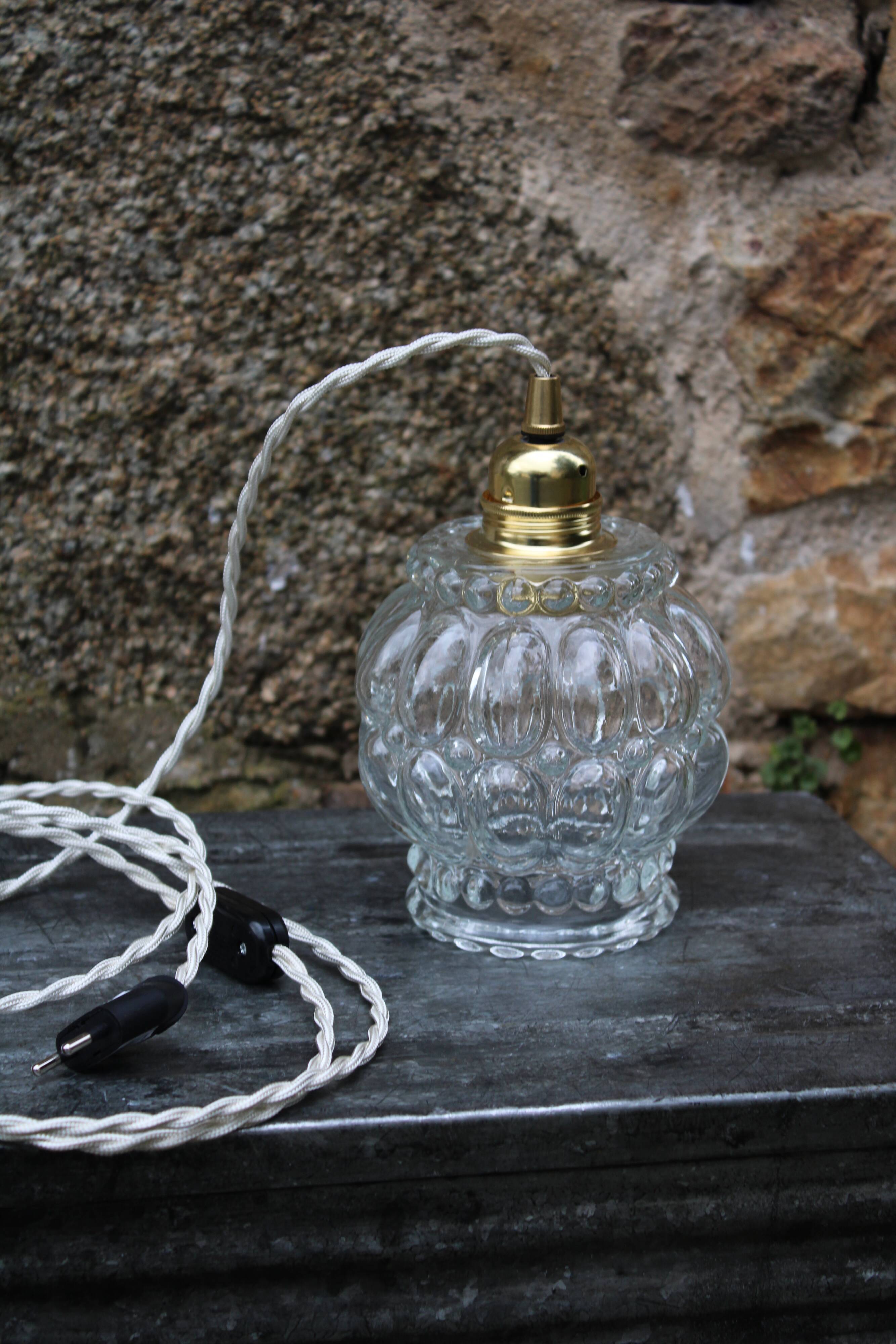 Moulded glass globe hand lamp
