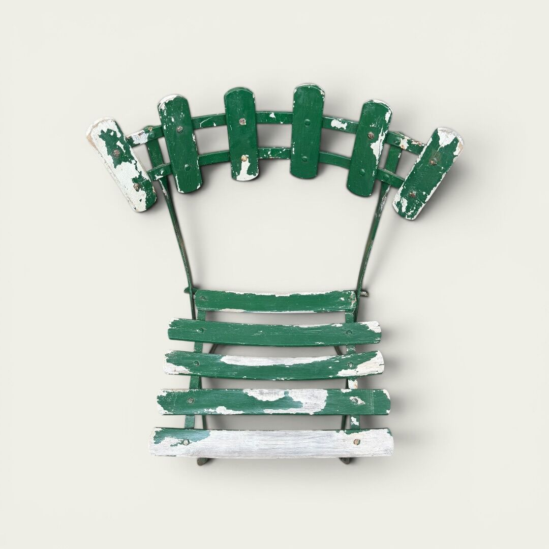 Pair of original patinated folding Parisian bistro chairs.