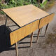 4 old chairs and an extendable table in 'faux wood' formica.