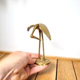 Brass heron head down