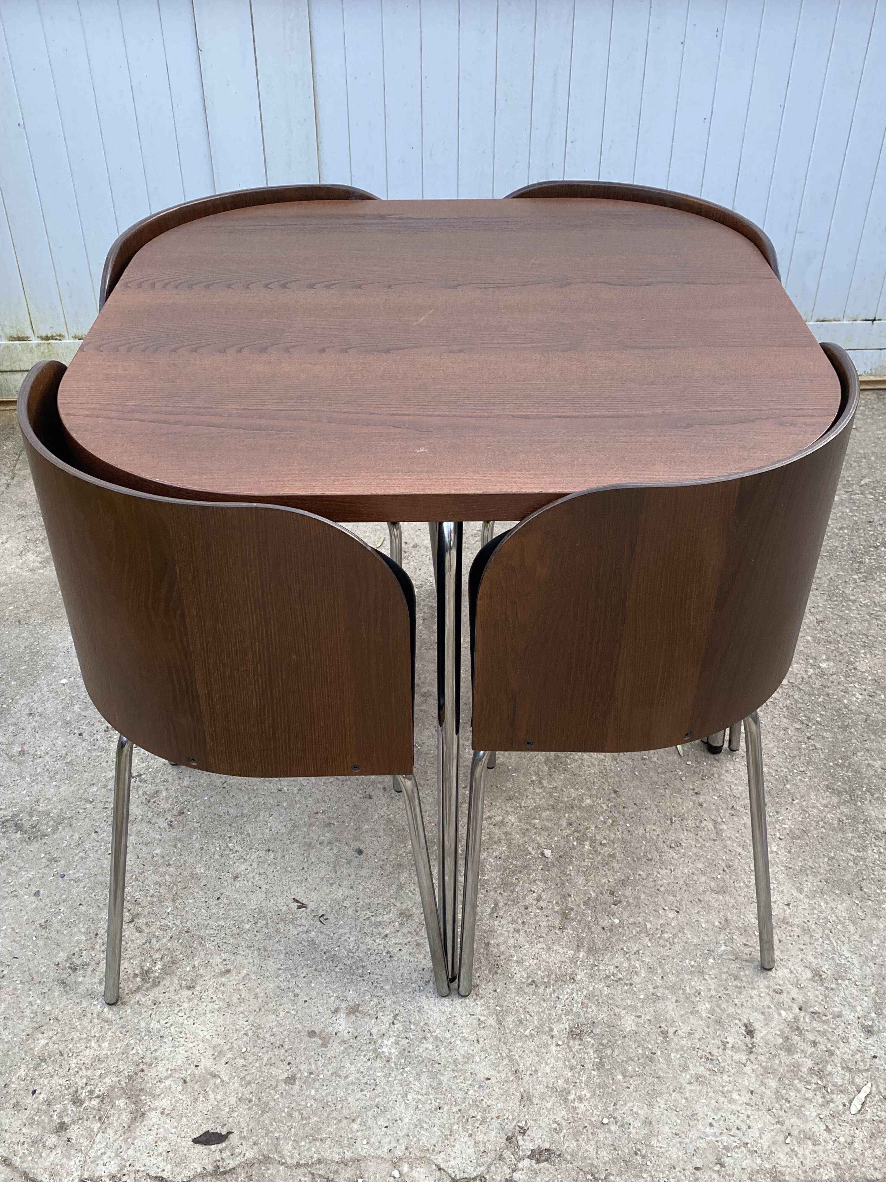 Fusion table and 4 teak chairs by Sandra Kragnert IKEA.