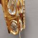 Swedish wall lamp in gold-colored metal with glass prisms. Estimated 1970-80s.
