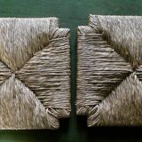 pair of bar stools, made of wood with a straw seat