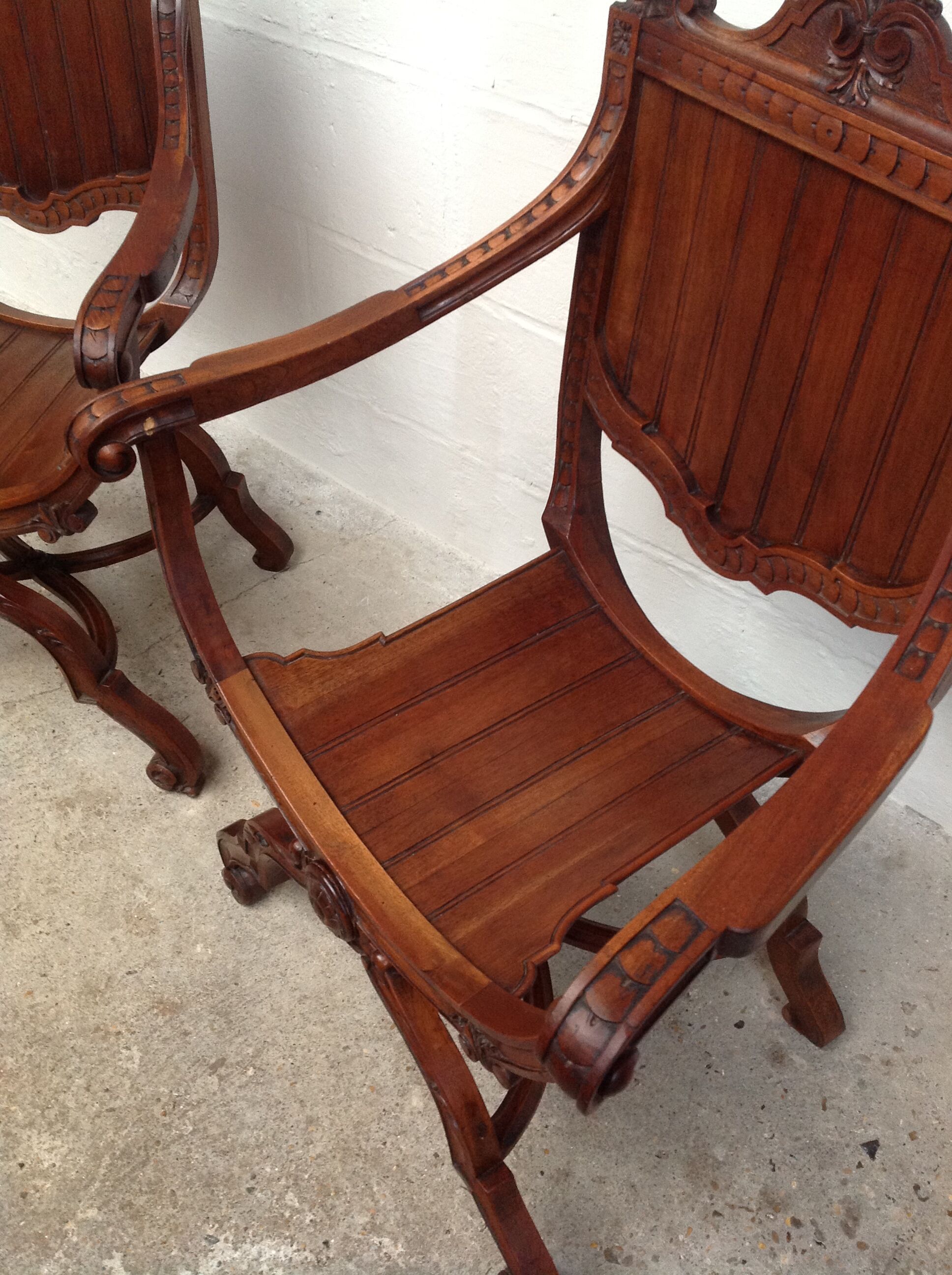 Pair of antique armchairs curules called Dagobert in carved wood