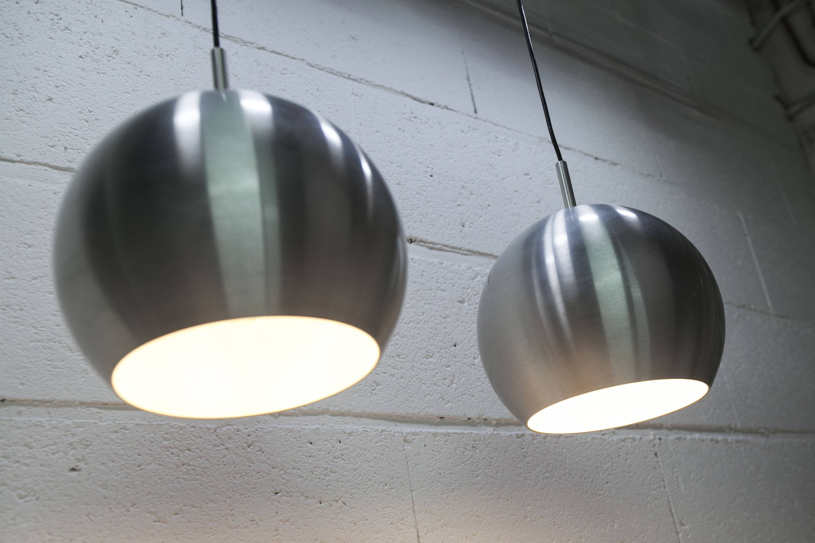 Pair of functional 70's aluminum ball pendants