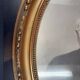 Oval medallion frame in wood and gilded stucco, Louis XVI style knot