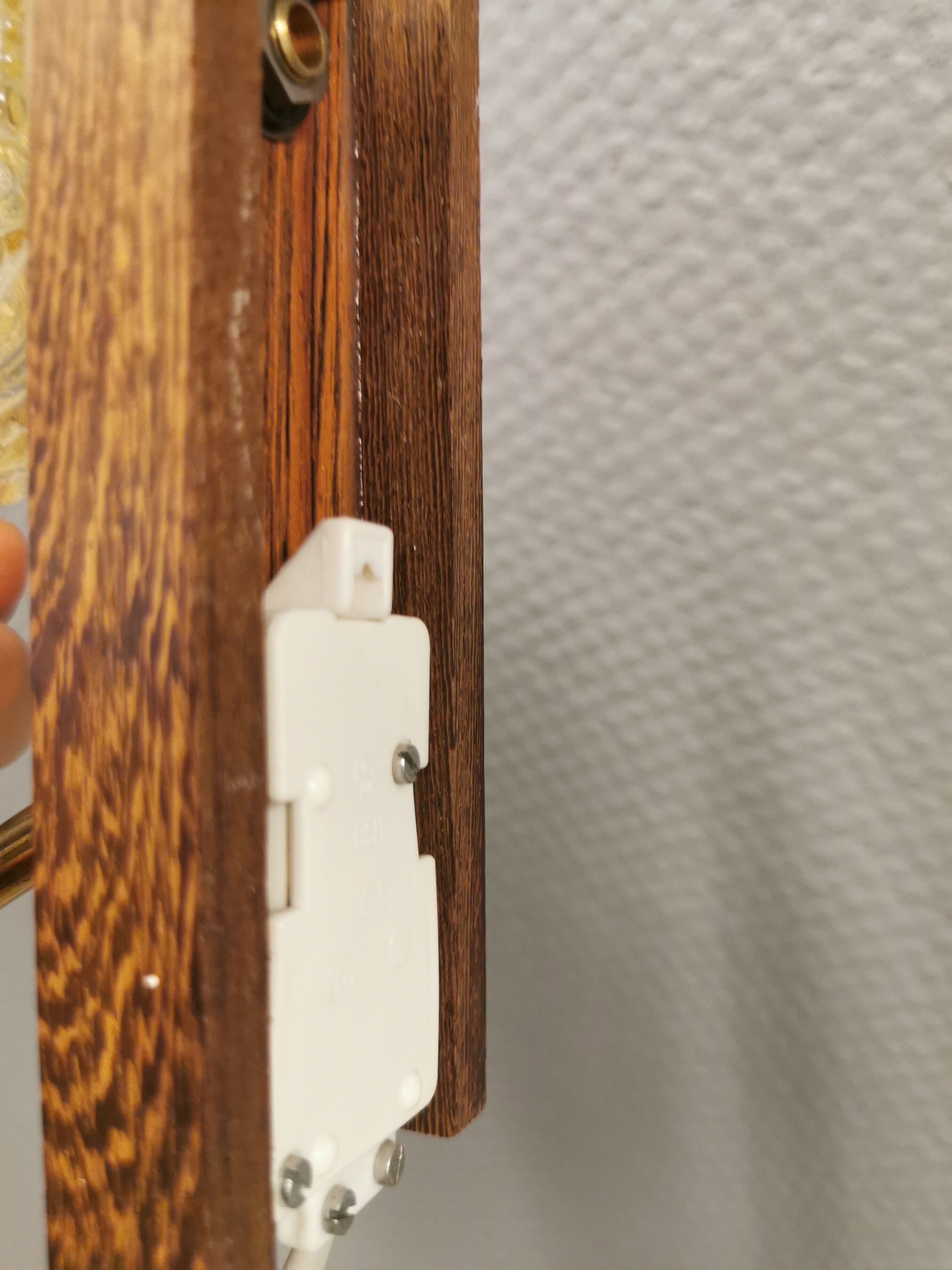 Wall light in rosewood with bobble glass ball shade.
