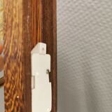 Wall light in rosewood with bobble glass ball shade.