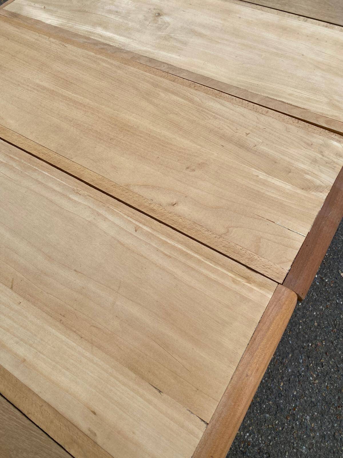 Large stripped solid oak dining table in Louis XVI style with 3 extensions.