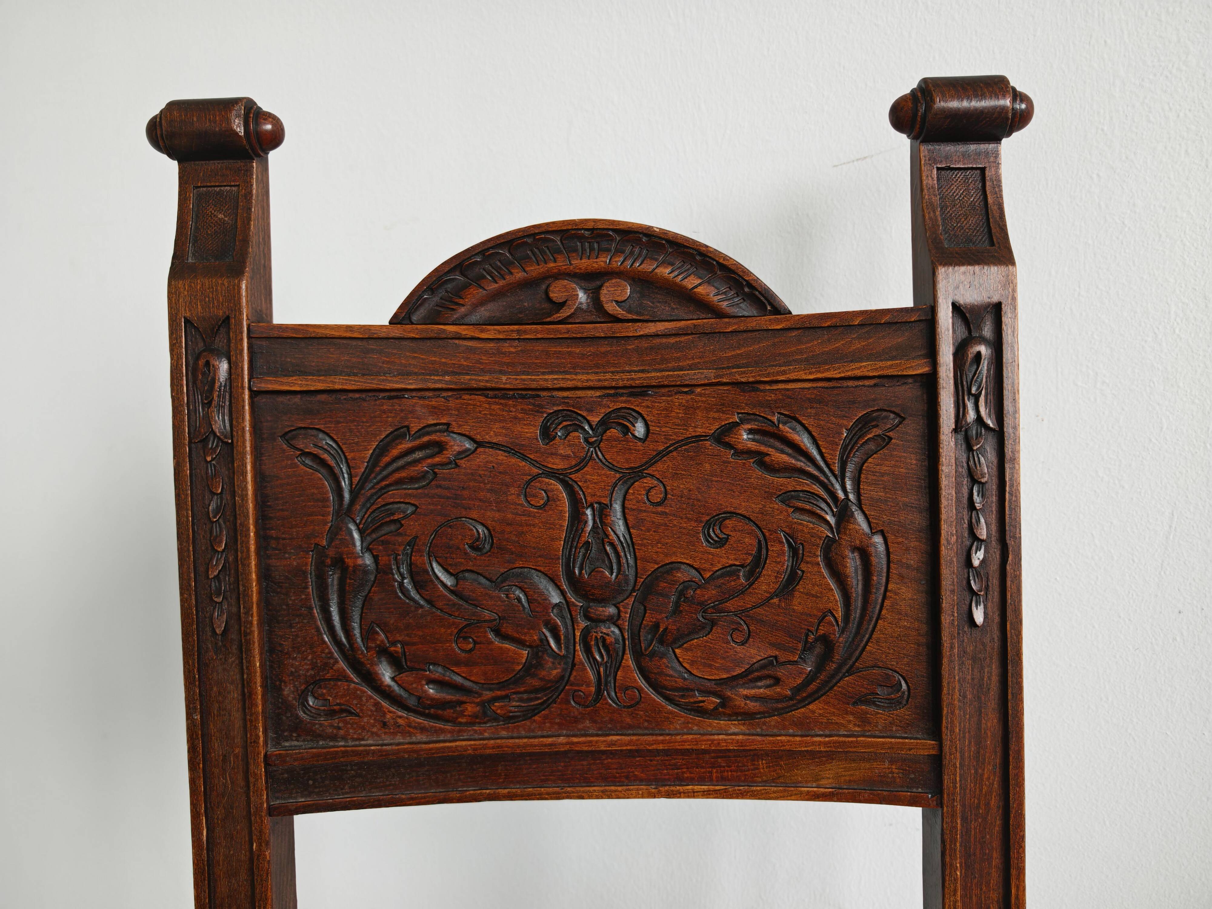 Pair of Neo-Renaissance oak chairs with straw seats, 1910